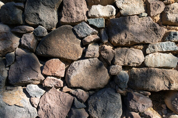 Masonry stone wall texture, no binding plaster, background.