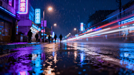 Obraz premium Lively street scene on a rainy night showcasing neon lights reflecting on wet pavement, ideal for nightlife ads or urban ambiance.