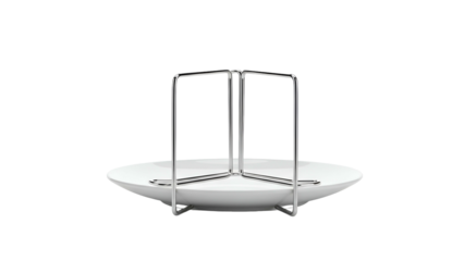 White dish with metallic framework for food presentation against a black background