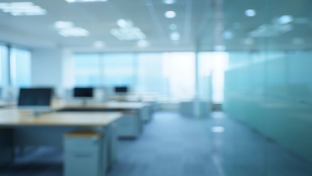Blurred office space with desks and computer screens