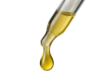 Dropper dispensing yellow essential oil or serum liquid, a golden drop forming on transparent background