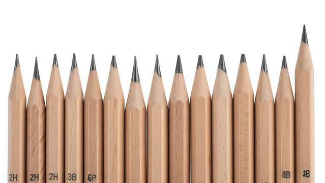 A close-up of a row of sharpened graphite pencils, various grades, against black