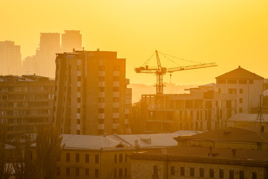 smoggy autumn sunset over urban houses in Yerevan