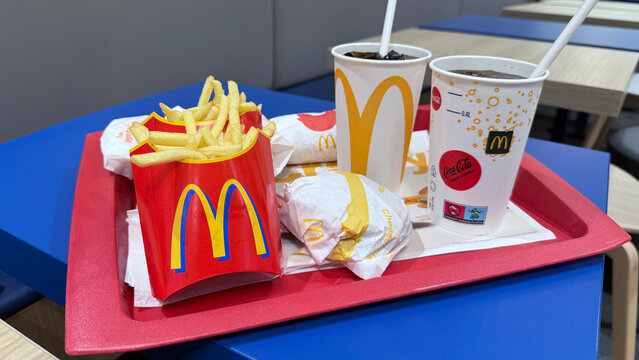 Krakow, Poland - October 11, 2025: McDonald's meal tray with fries, burgers, and drinks in fast food restaurant