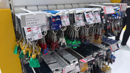 Obraz premium Wroclaw, Poland - October 24, 2025: Marvel LEGO keychains displayed on rack in retail store with copy space