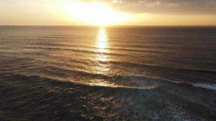dusk ocean shimmer, cinematic footage depicting calm sea with radiant dusk hues and gentle ripples