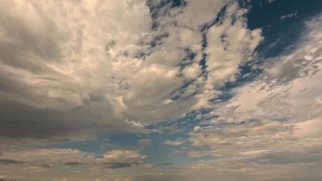 Picturesque nature, summer light blue sky with clouds accelerated shooting of cloudy landscape. Cinematic beautiful celestial floating clouds across sky. Beautiful sky, white clouds flying, time lapse