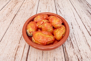 Oven-roasted potatoes with coarse sea salt are accompanied by two contrasting sauces: lemon mayonnaise and homemade saffron aioli