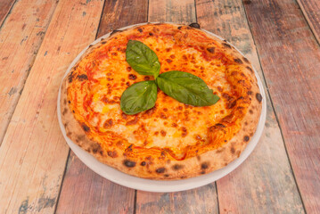 A close-up captures the precise moment a slice of pizza is stretched, creating a delicious thread of melted cheese.