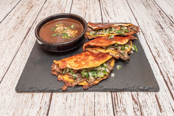 Beef tongue tacos, slow-cooked until tender, with cilantro, onion, and red molcajete salsa