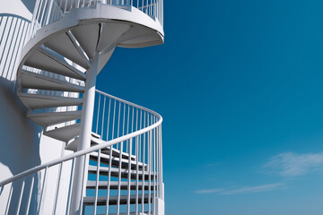 a spiral staircase against the blue sky, side view, flat lay photography, minimalism, 