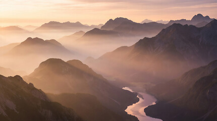 Misty mountain landscape with winding river valley during golden sunrise