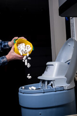 Home owner adds salt to a garage softener