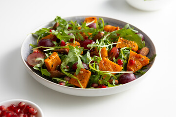  baked pumpkin and grapes autumn salad light surface