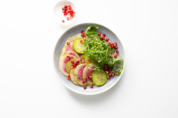 Winter watermelon radish salad light surface top view