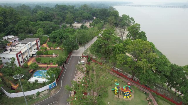 Aerial shot of Keshariya Stupa in Bihar capturing its massive circular structure, layered terraces and surrounding landscape. Ancient Buddhist architecture seen from above in clear natural light.
