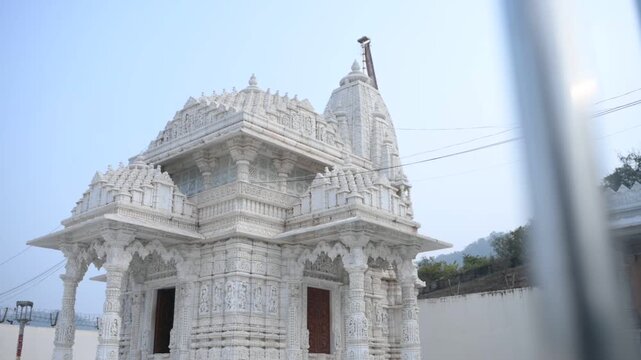 Aerial and ground shots of Lacchuar Jain Temple in Jamui, Bihar showcasing its ancient Jain architecture, serene hilltop setting and peaceful natural surroundings. Clear details, clean lines and herit