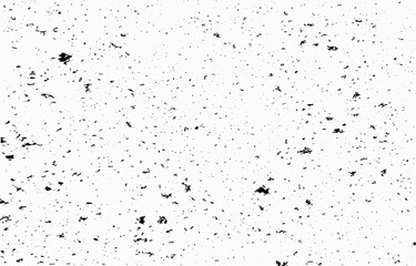 Abstract grunge vector background featuring scattered black textures on a light surface for creative design projects and artistic expressions