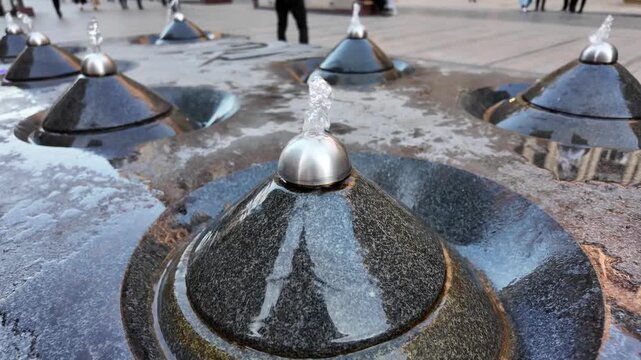 Drinking fountains in Yerevan in the evening. Close up