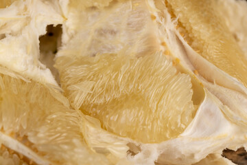 peel and soft juicy flesh of ripe grapefruit, sweet fresh grapefruit peeled from the yellow thick peel