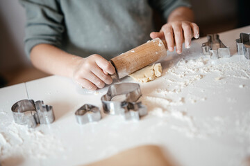 Homemade Christmas Cookies In Preparation: Hands Kneading Dough, Cutting Shapes, And Decorating Biscuits With Chocolate In Cozy Kitchen Atmosphere