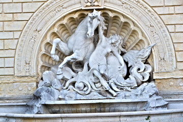 Dramatic Marble Sculpture Of Horse, Woman, And Serpent Relief In Ornate Architectural Fountain