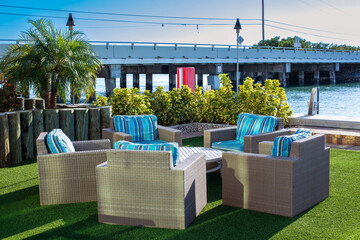 table and chairs on outdoor terrace by the ocean