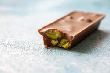  Close-Up of Pistachio Chocolate on Blue Background
