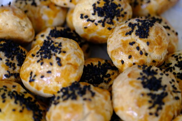 Delicious homemade black cumin and cheese pastries. Cactus ivy in the background. Parsley and cheese breakfast pastries. Ramadan iftar menu. Traditional Turkish pastries.