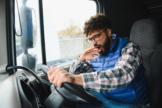 Truck driver yawning due to fatigue while driving