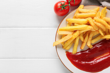 Plate with tasty french fries, ketchup and tomatoes on white wooden background