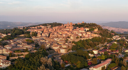 Fototapeta premium Historic hilltop town of Volterra at sunset - Volterra, Italy