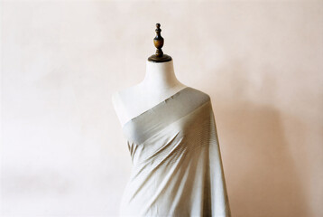 Light Beige Draped Fabric on Mannequin – Minimalist Fashion Draping
