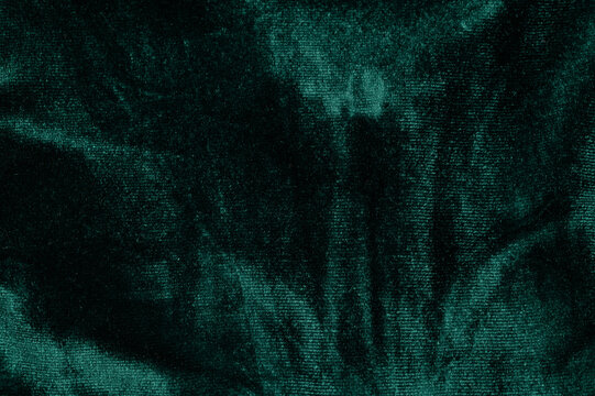 Rich green velvet fabric with unique texture and pattern details