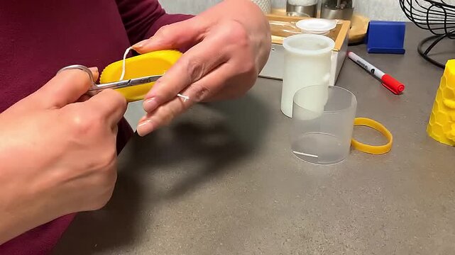 Making beeswax candles at home.