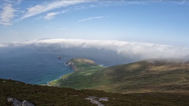 moving clouds over the ocean at dunmore head, slea head drive, dingle peninsula