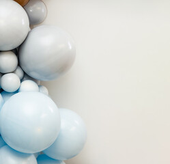 Minimalistic arrangement of matte white balloons on a clean background, creating a soft modern party decoration layout with empty copy space.