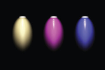 Three vibrant spotlights illuminate the darkness with different colors yellow purple and blue on black background