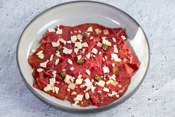 Beef Carpaccio cold appetizer with parmesan
