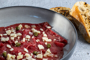 Beef Carpaccio cold appetizer with parmesan