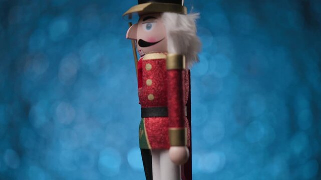 Cool looking Nutcracker is spinning on a bright blue background