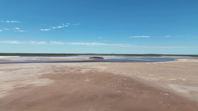 Aerial Lake Amadeus salty mud basin is the largest salt lake in Northern Territory Australia, about 50 km north of Uluru or Ayers Rock, stretching 180 kilometers long and 10 kilometers wide, salt lake
