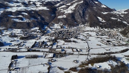 Aerial view of snowy Pasturo in Valsassina, Lombardy, Italy
