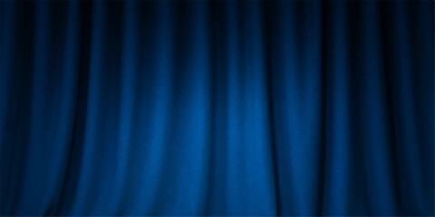 Blue velvet stage curtain backdrop illuminated by a theatrical spotlight, perfect for a show or cinema performance