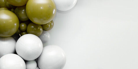 Minimalist balloon backdrop with white and olive-green balloons clustered on the left side, creating a modern festive composition with clean negative space on the right.