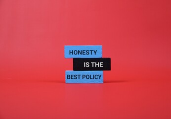 Stacked blue and black blocks spell out 'Honesty Is The Best Policy' against a red backdrop, conveying truth, integrity, and clear communication in a clean, modern visual.