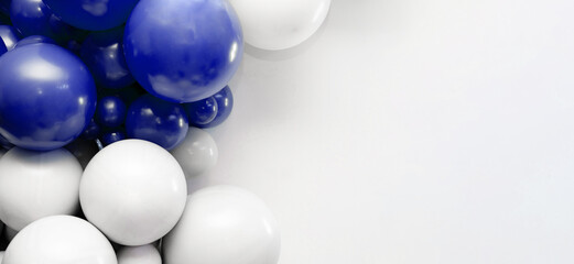 Blue and white balloon garland on a clean white background, festive decorative backdrop ideal for celebrations, parties, and event design.
