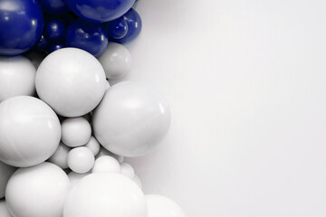 Blue and white balloon garland on a clean white background, festive decorative backdrop ideal for celebrations, parties, and event design.