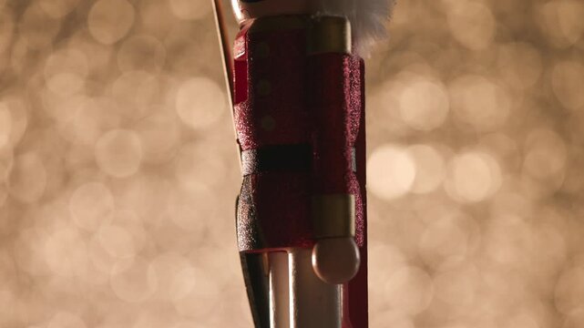 Colorful bokeh studio backdrop highlights a spinning Toy Nutcracker, finishing with a detailed head shot