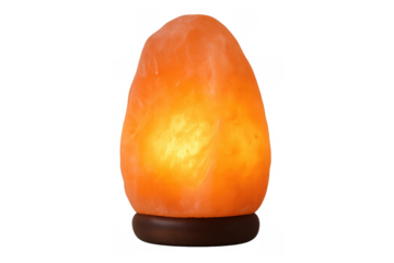 Himalayan salt lamp emits a soft, warm orange light from rock salt, creating a peaceful, relaxing atmosphere on transparent background